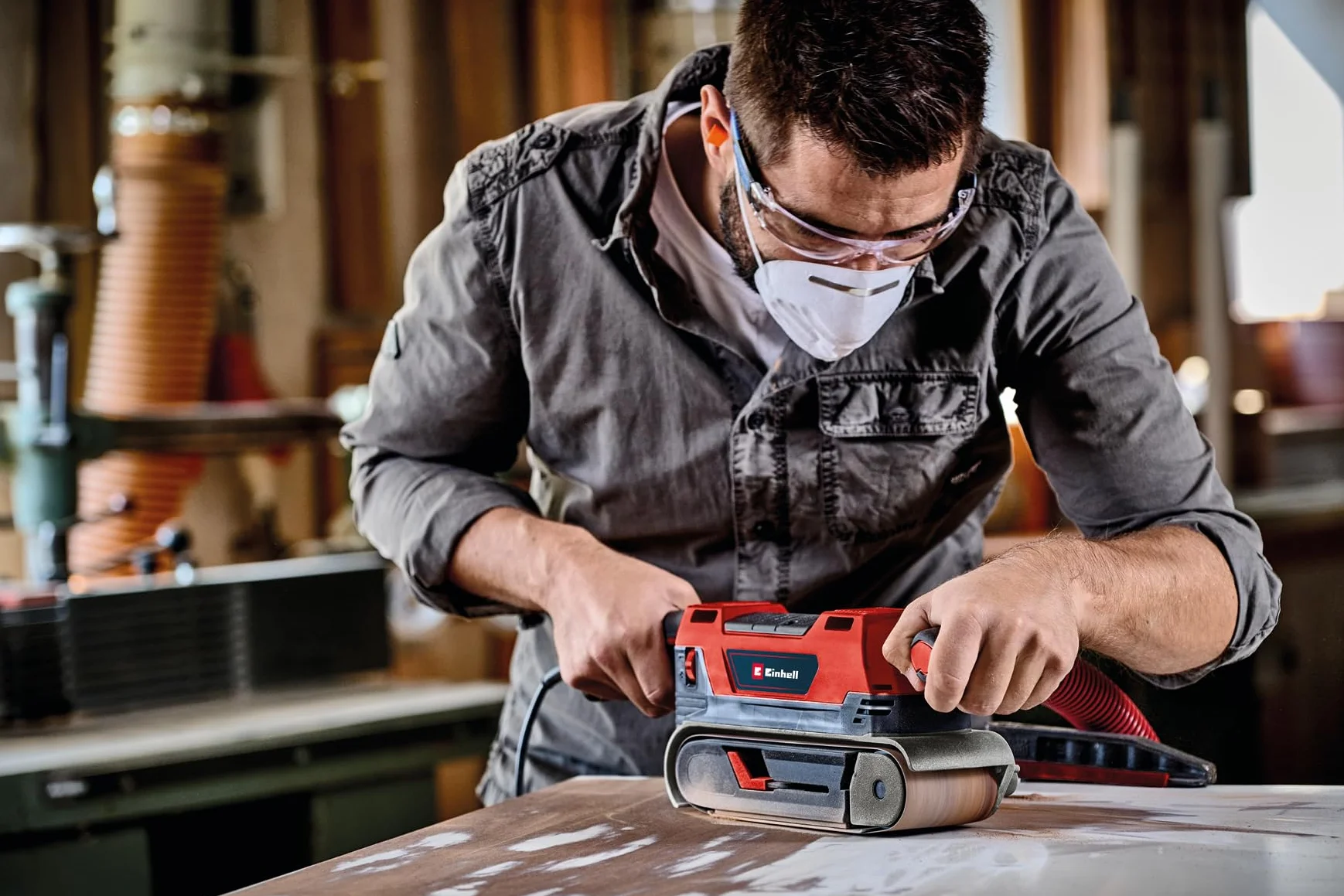 Einhell Lijadora de banda TE-BS 850 E (850 W, velocidad de la cinta abrasiva de 400 m/min, ajuste fino de la marcha de la banda, aspiración de polvo, también para uso estacionario, incl. accesorios)